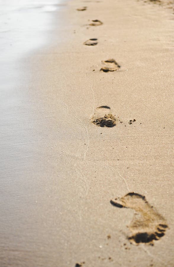 Human Footprints on the Beach Sand. Traces on the Beach of a Man or a ...