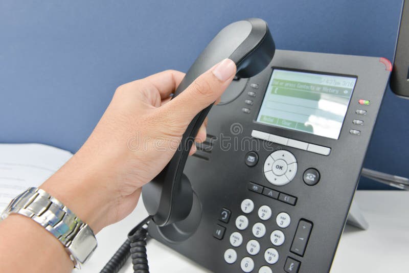 Human hand picking up the telephone stock photo