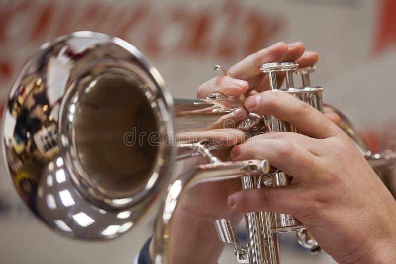 Human hand playing the flugelhorn stock image Human hand playing the flugelhorn stock image