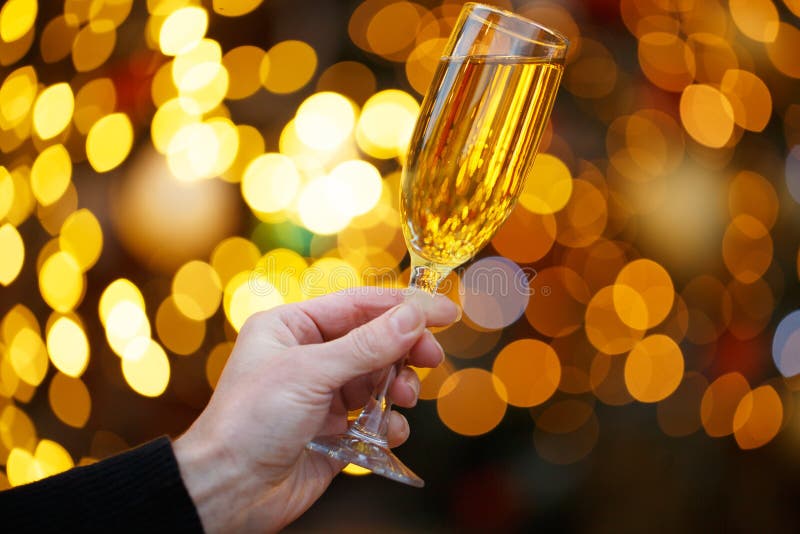 Human Hands With Glasses Of Champagne On A Christmas Or New Year