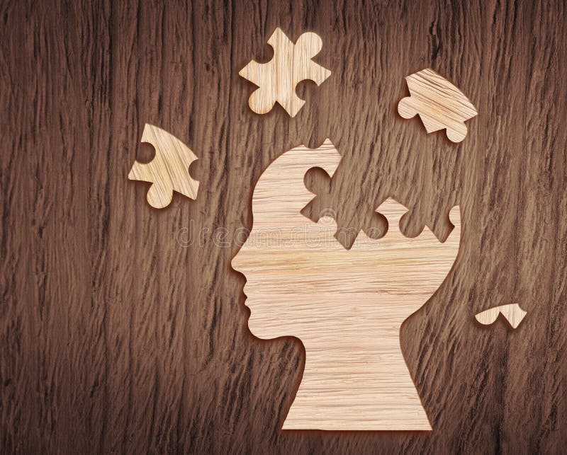 Human head silhouette with a jigsaw piece cut out stock image Human head silhouette with a jigsaw piece cut out stock image