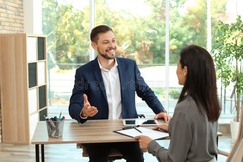 Human Resources Manager Conducting Job Interview with Applicant Stock