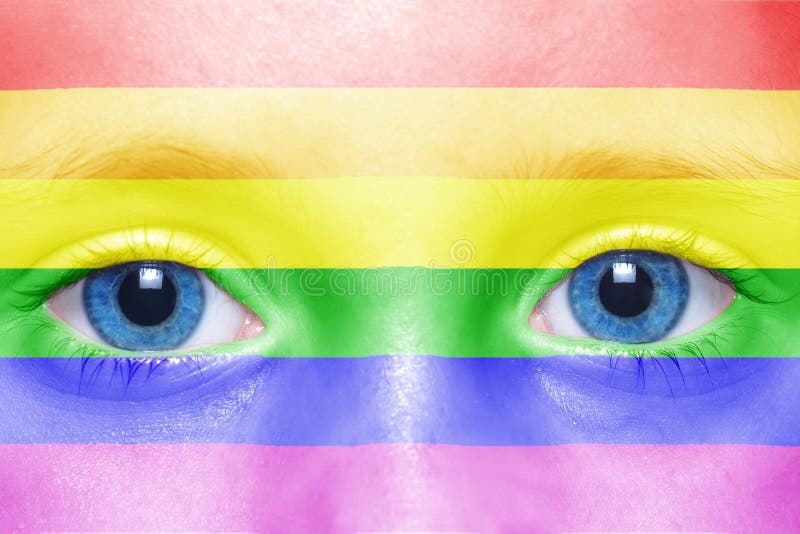 Human`s face with rainbow flag stock photography Human`s face with rainbow flag stock photography