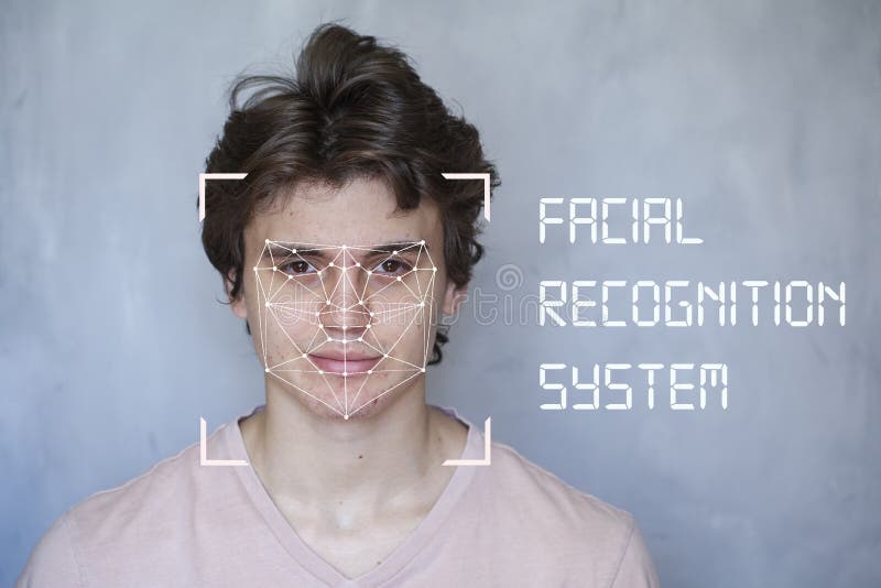 Human Security IT technology, Facial recognition system, concept. Young man on the gray background, face recognition stock photos