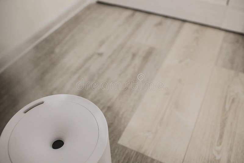 Humidifier spreading steam into the living room. royalty free stock images