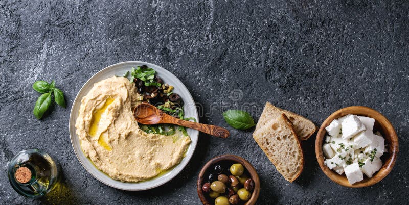 Hummus with olives and herbs