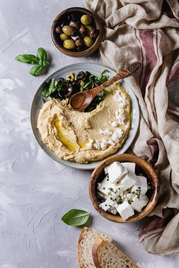 Hummus with olives and herbs