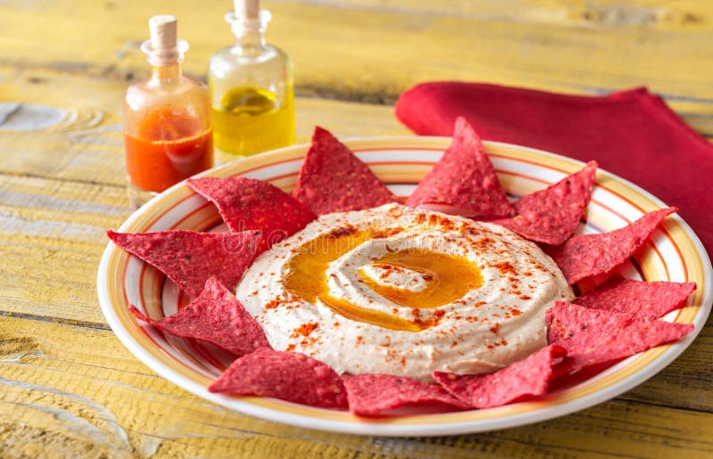 Hummus with tortilla chips stock photo. Image of creamy 161380834