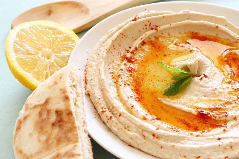 Hummus dip plate and lemon. Hummus dip plate and lemon