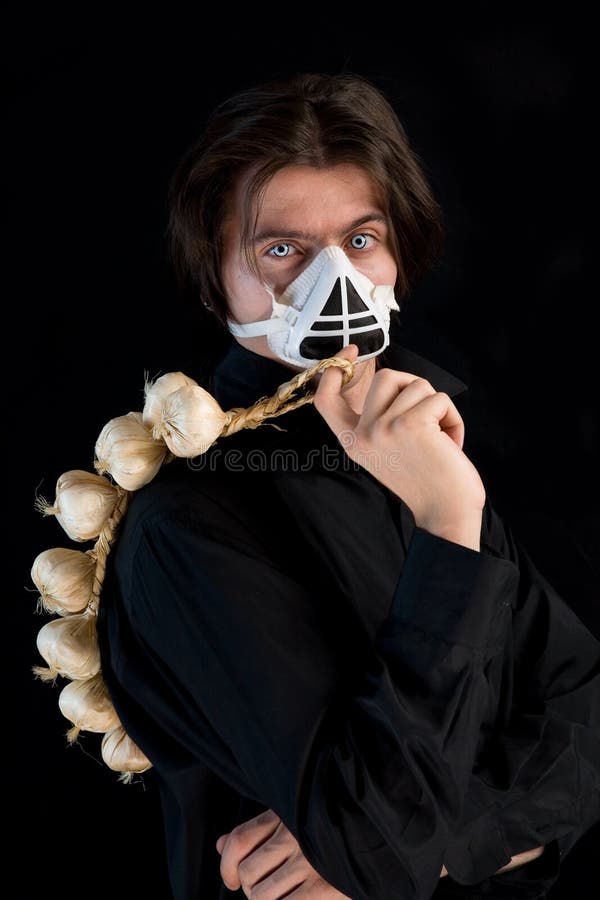 Humorous shot of vampire in respirator stock photo