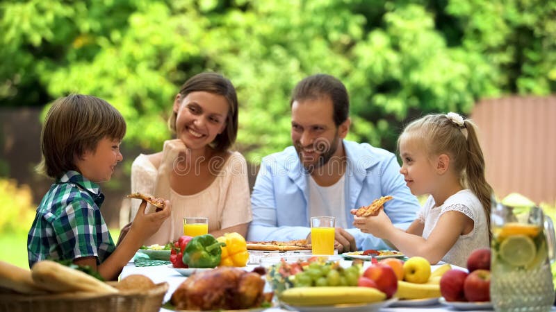 Hungry kids eating delicious pizza, childrens favorite food, italian cuisine royalty free stock image Hungry kids eating delicious pizza, childrens favorite food, italian cuisine royalty free stock image