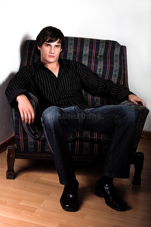 Hunk on chair royalty free stock photo Hunk on chair royalty free stock photo