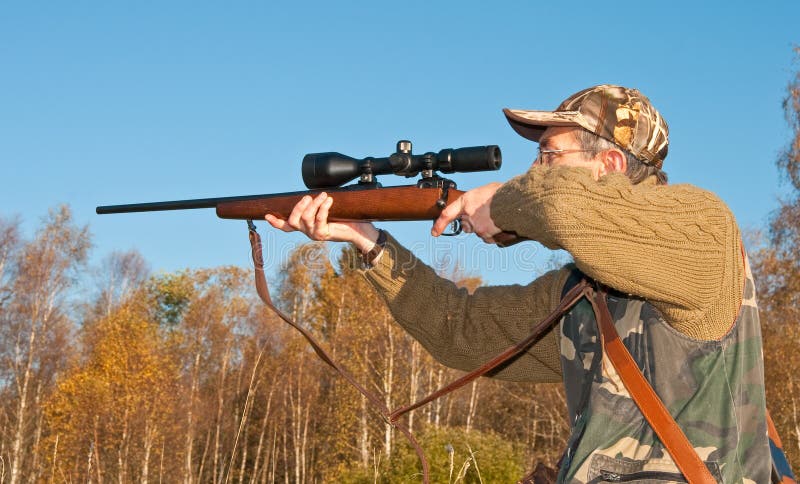 Hunter aiming animals royalty free stock photo