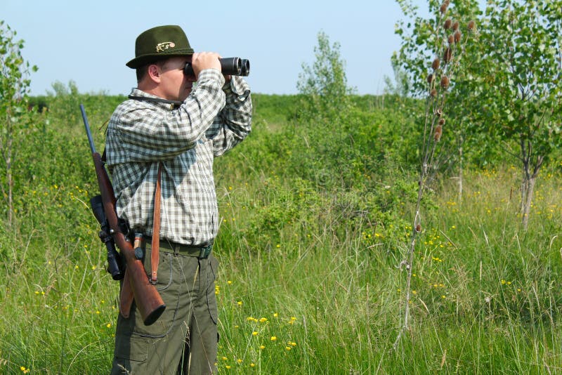 Hunter with binoculars stock image