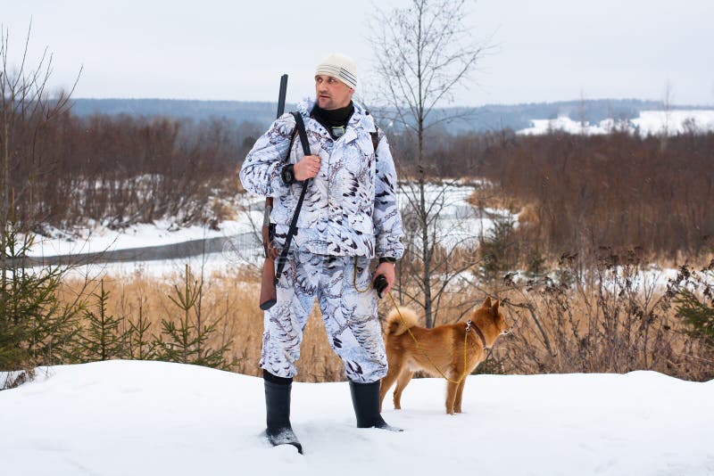 Hunter with dog in winter stock photo. Image of outdoors 49003178