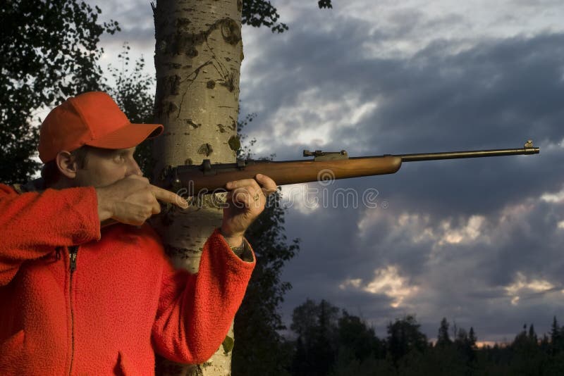 Hunter with rifle stock image