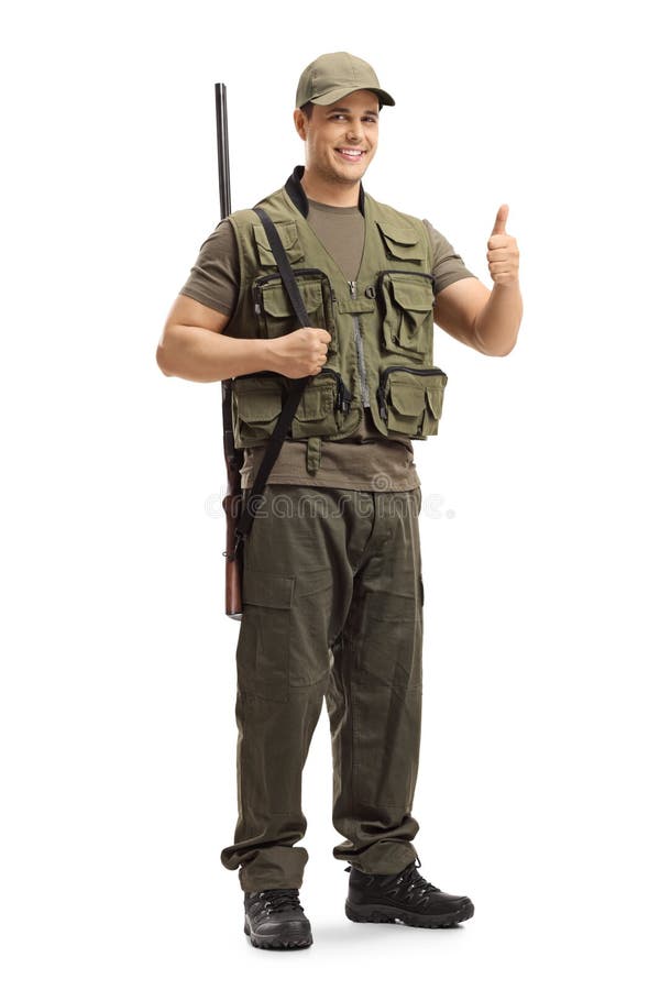 Hunter with a shotgun on his shoulder showing thumbs up sign stock photo Hunter with a shotgun on his shoulder showing thumbs up sign stock photo