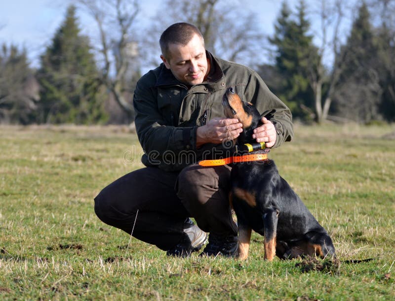 Hunter strokes his dog stock photos Hunter strokes his dog stock photos