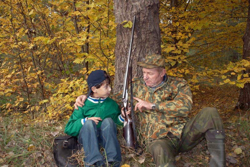 Hunters with a gun stock image
