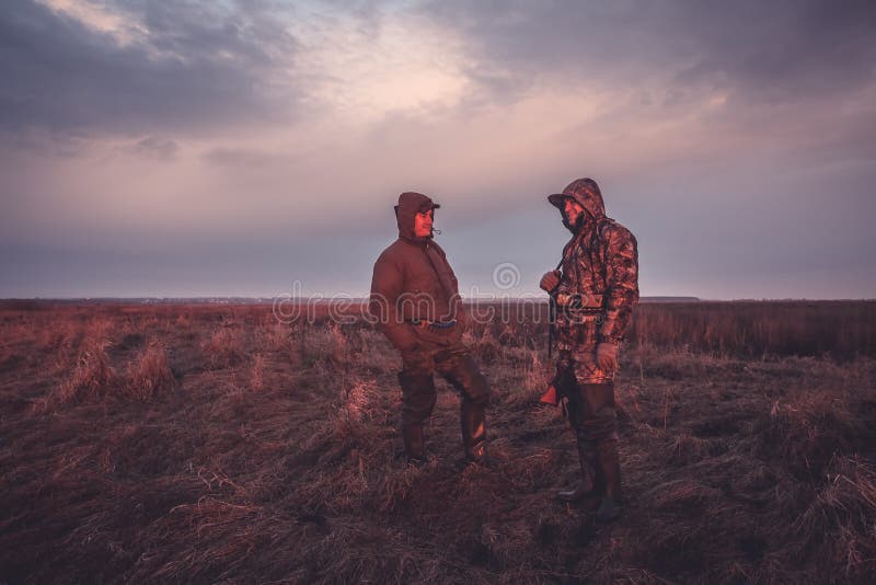 Hunters hunting season in rural field at sunrise royalty free stock images Hunters hunting season in rural field at sunrise royalty free stock images