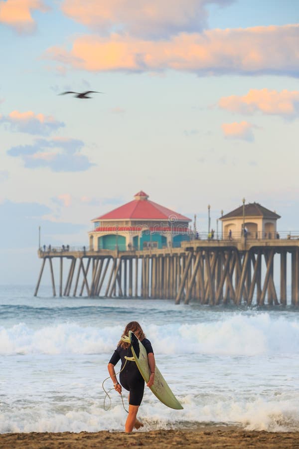 The Huntington Beach pier at sunrise stock photography