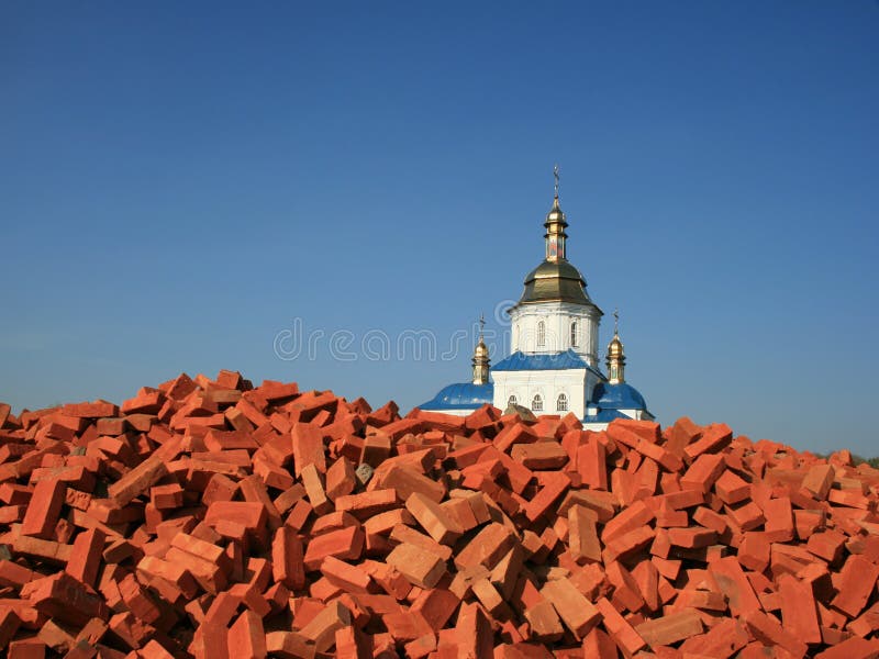 Hurch over red bricks pile 3