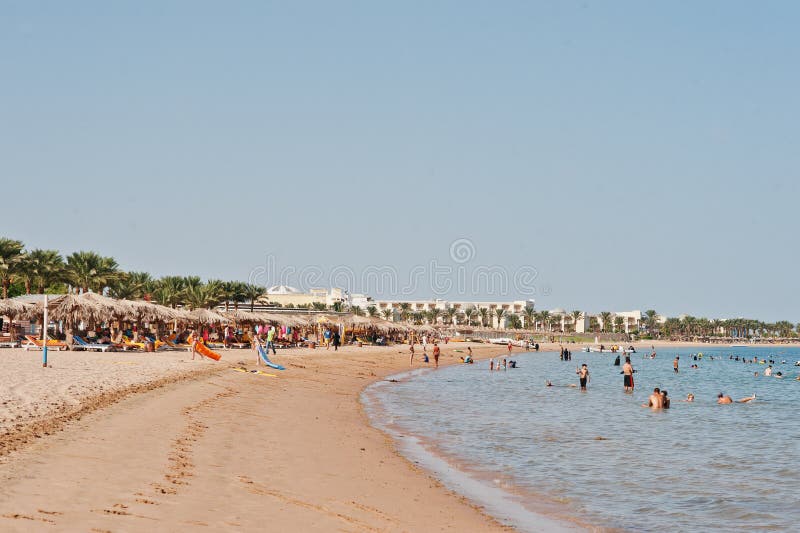 Hurghada, Egypt -20 August 2016: Beach with people in resort. Hurghada, Egypt -20 August 2016: Beach with people in resort.