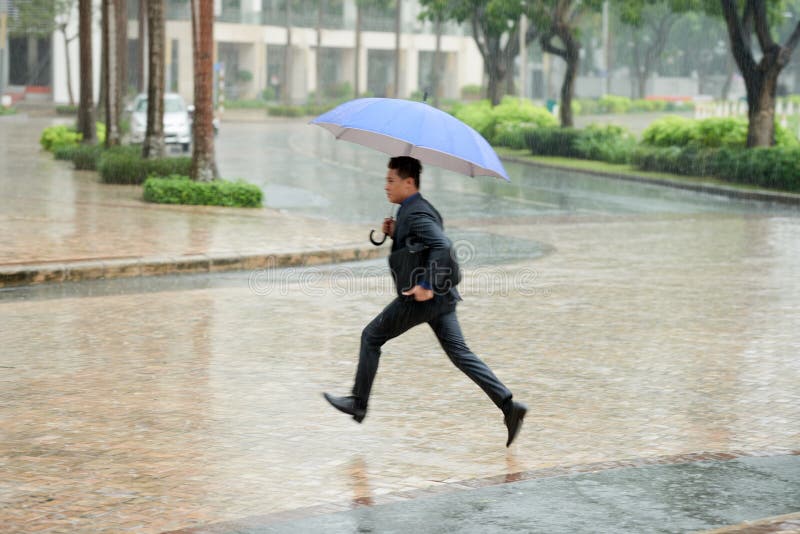 Hurrying Home in Pouring Rain royalty free stock photography Hurrying Home in Pouring Rain royalty free stock photography