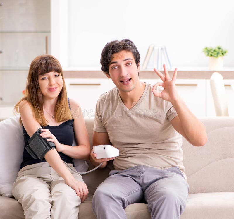 The Husband Checking Wife`s Blood Pressure Stock Photo Image of heart, cardio 131722202