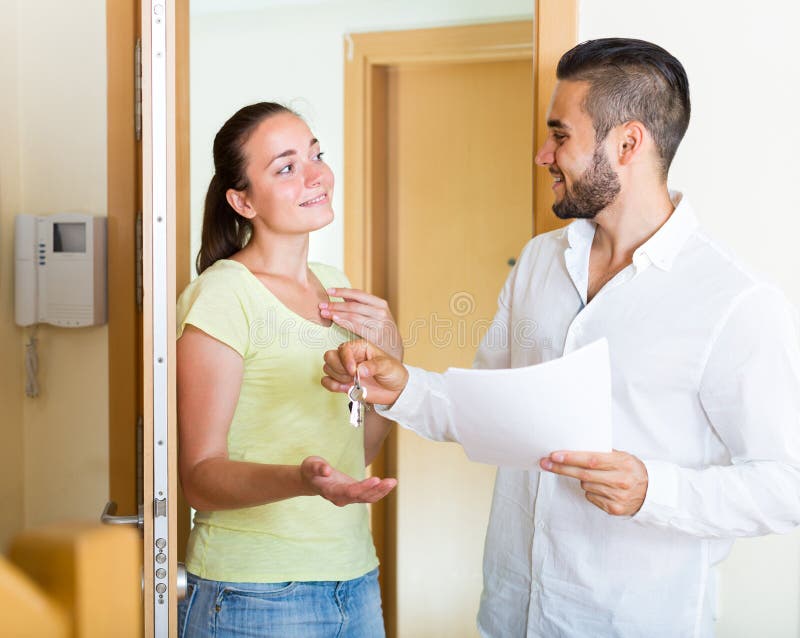 Husband giving the keys to apartment royalty free stock images Husband giving the keys to apartment royalty free stock images