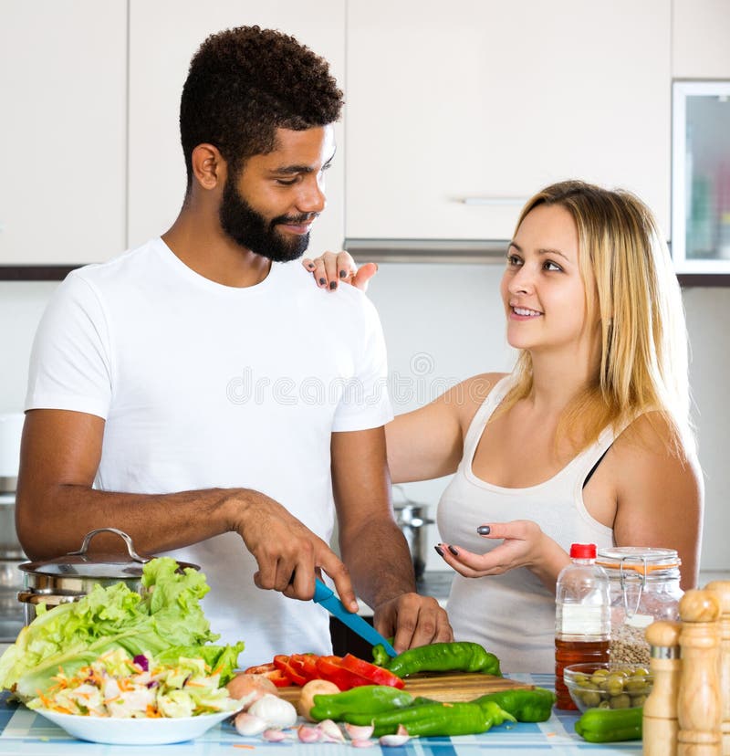 Helping the wife. Wife preparing meal.