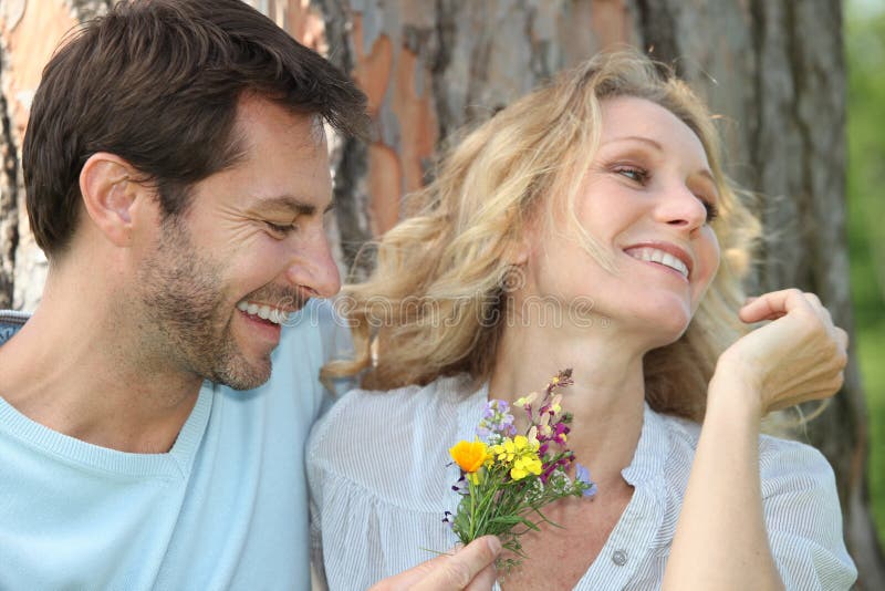 Download Husband Offering Wife Flowers Stock Image - Image of husband, white: 23492203