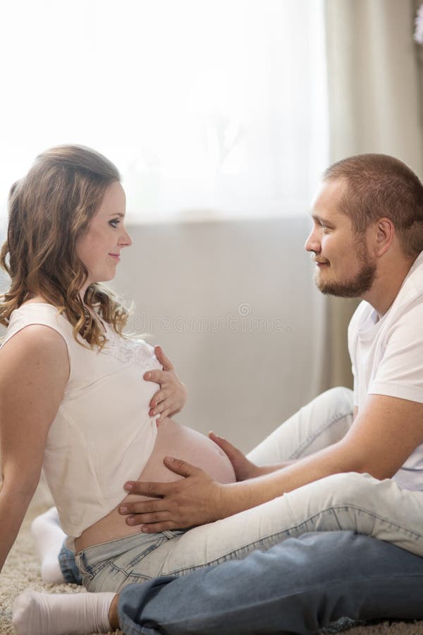 Husband and pregnant wife stock im