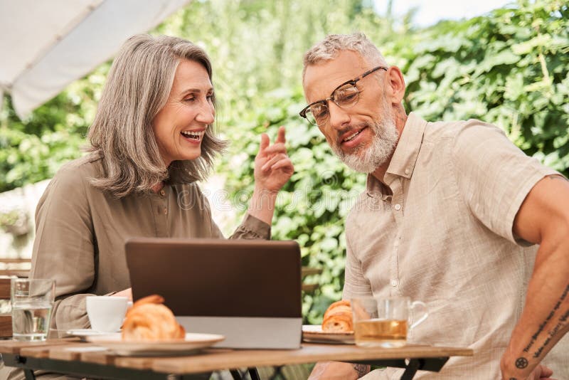 Senior Husband and Wife Preparing Food in Kitchen Stoc image