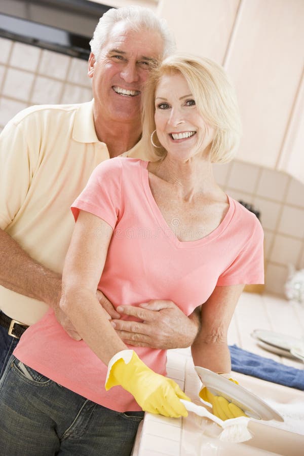 Husband And Wife Cleaning Dishes stock photos Husband And Wife Cleaning Dishes stock photos