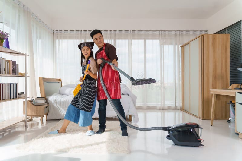 Husband and Wife Couple Have Fun Do Housework Together Stoc picture