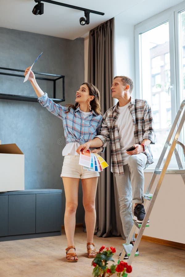 Husband and Wife Discussing the Interior for Their Living Room St