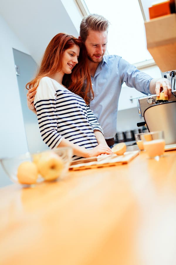 Husband and Wife Making Orange Juice Stock Ph