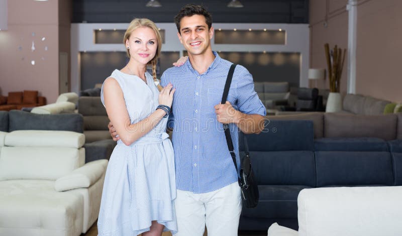 Husband and Wife are Satisfied by Buying New Sofa Stock Photo image