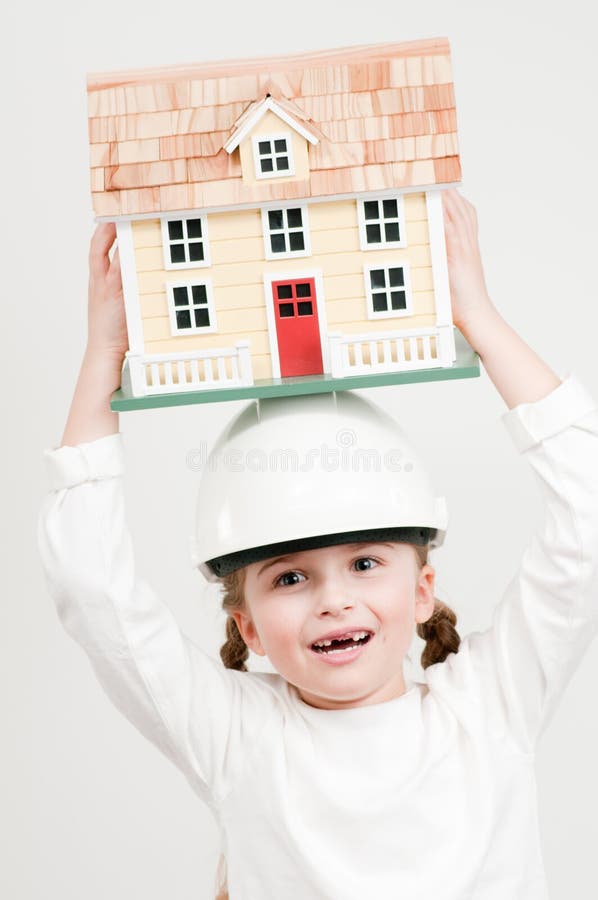House constructor - Little girl with house model. House constructor - Little girl with house model