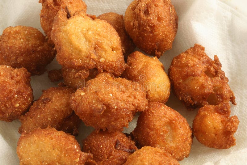 Hush Puppies on paper towels, soaking up the grease.