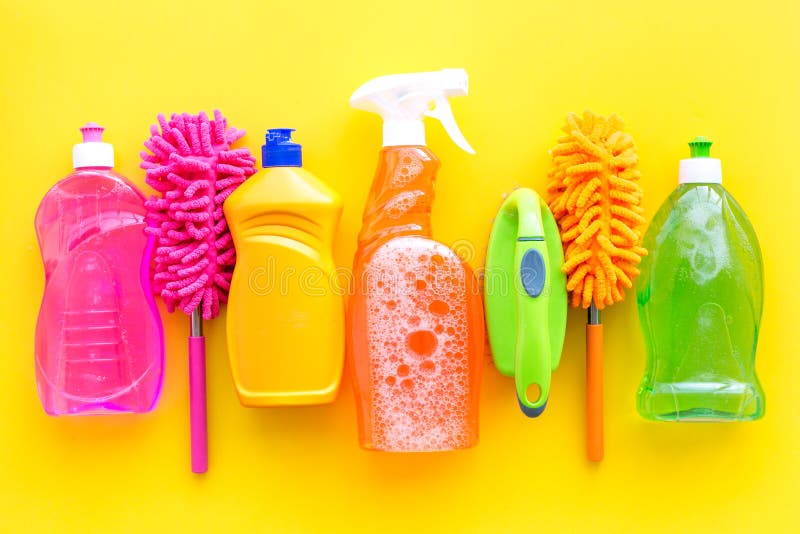 Housekeeping set. Detergents, soap, cleaners and brush for housecleaning on yellow background top view mock-up. Housekeeping set. Detergents, soap, cleaners and brush for housecleaning on yellow background top view mock-up.