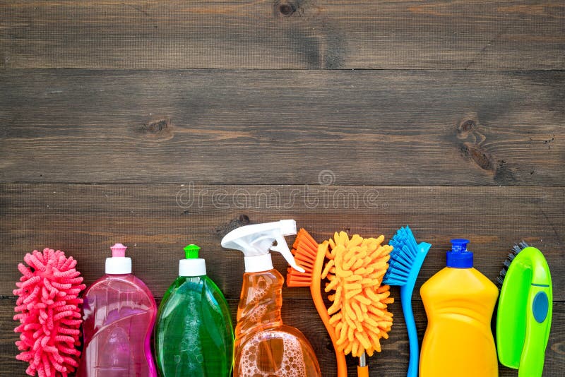 Housekeeping set. Detergents, soap, cleaners and brush for housecleaning on wooden background top view mock-up. Housekeeping set. Detergents, soap, cleaners and brush for housecleaning on wooden background top view mock-up.