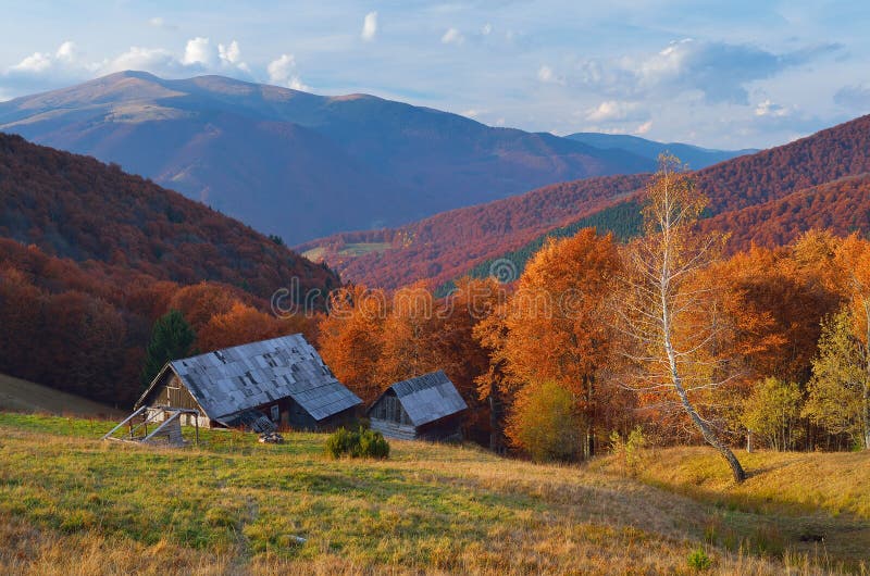 Hut in a mountain forest. Autumn Landscape