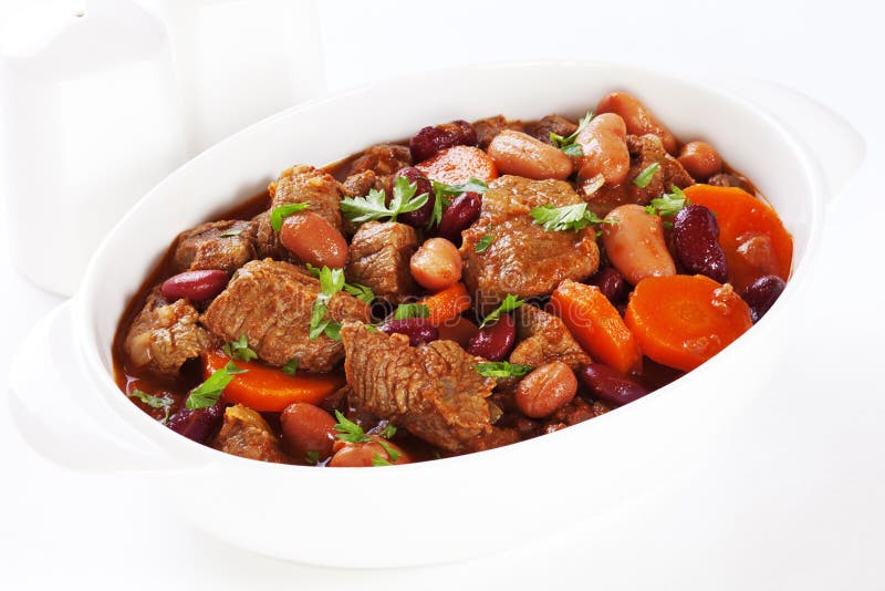 A simple bowl of stew with carrots and beans. A simple bowl of stew with carrots and beans.