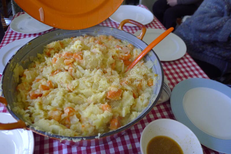 Hutspot Traditional and Authentic Dutch Food of Mashed Potatoes, Carrots  and Onions Topped with Bacon Close Up in the Bowl. Stock Photo - Image of  menu, dish: 234865524