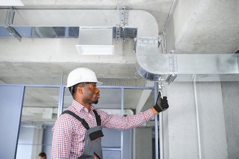 Hvac African Worker Install Ducted Pipe System for Ventilation and Air