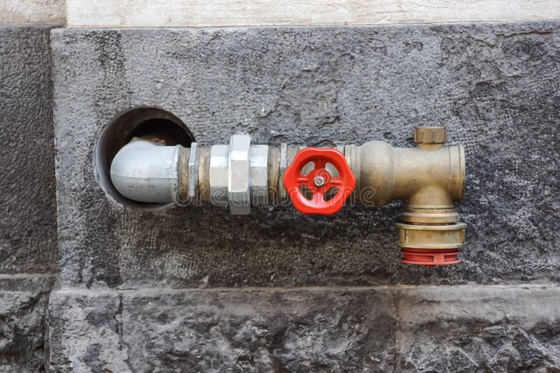 Hydrant with Water Hoses and Fire Extinguish Equipment on Wall Stock