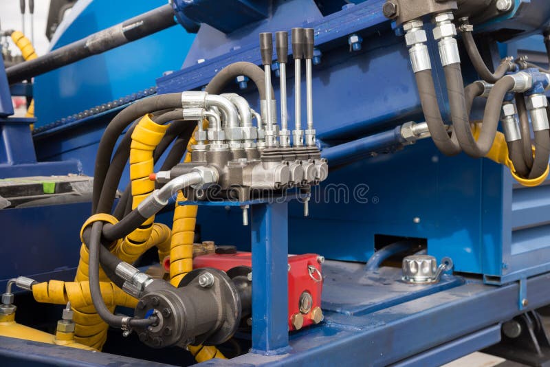 Hydraulic Tubes, Fittings and Levers on Control Panel Stock Image