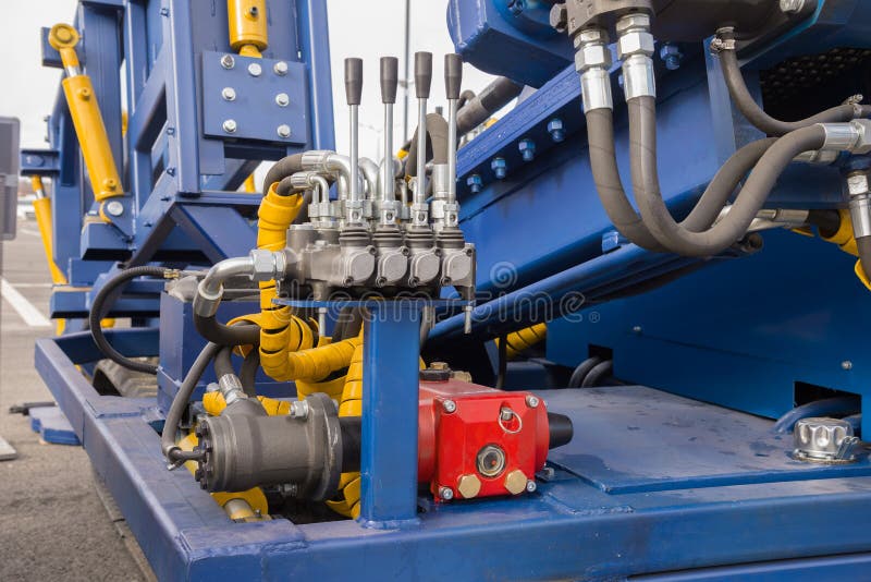 Hydraulic Tubes, Fittings and Levers on Control Panel, Close Up of Pipe